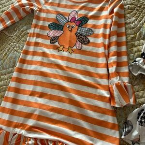 Orange and White Striped Dress with Cartoon Turkey Design